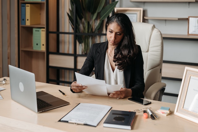  a person at a desk reading papers